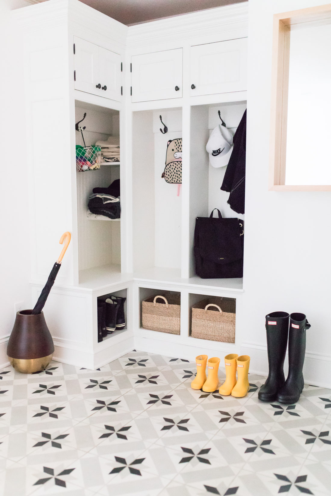 The Black and white mud room in Eva Amurri Martino's Connecticut home featuring black and white patterned cement tile