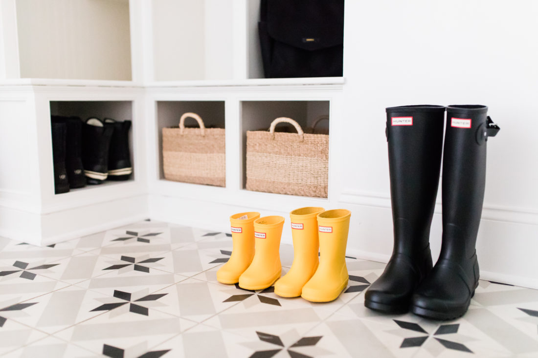 The black and white tiled mud room, with natural woven accents, in Eva Amurri Martino's Connecticut home