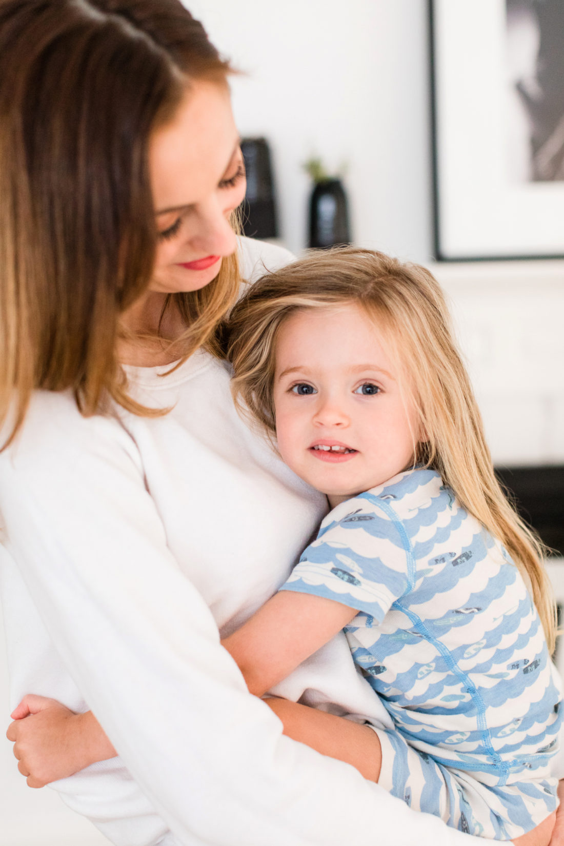 Eva Amurri Martino wears pajamas and snuggles three year old daughter Marlowe in the kitchen of her Connecticut home