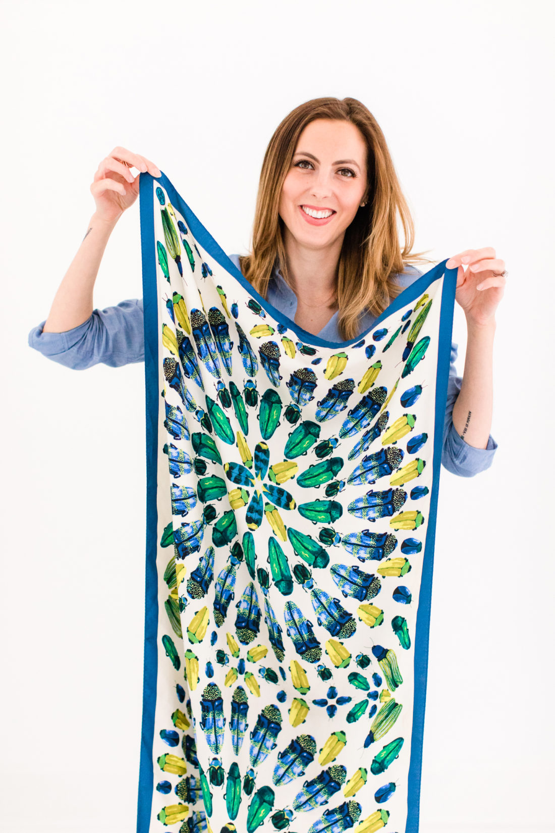 Eva Amurri Martino holds up a printed silk tory burch scarf