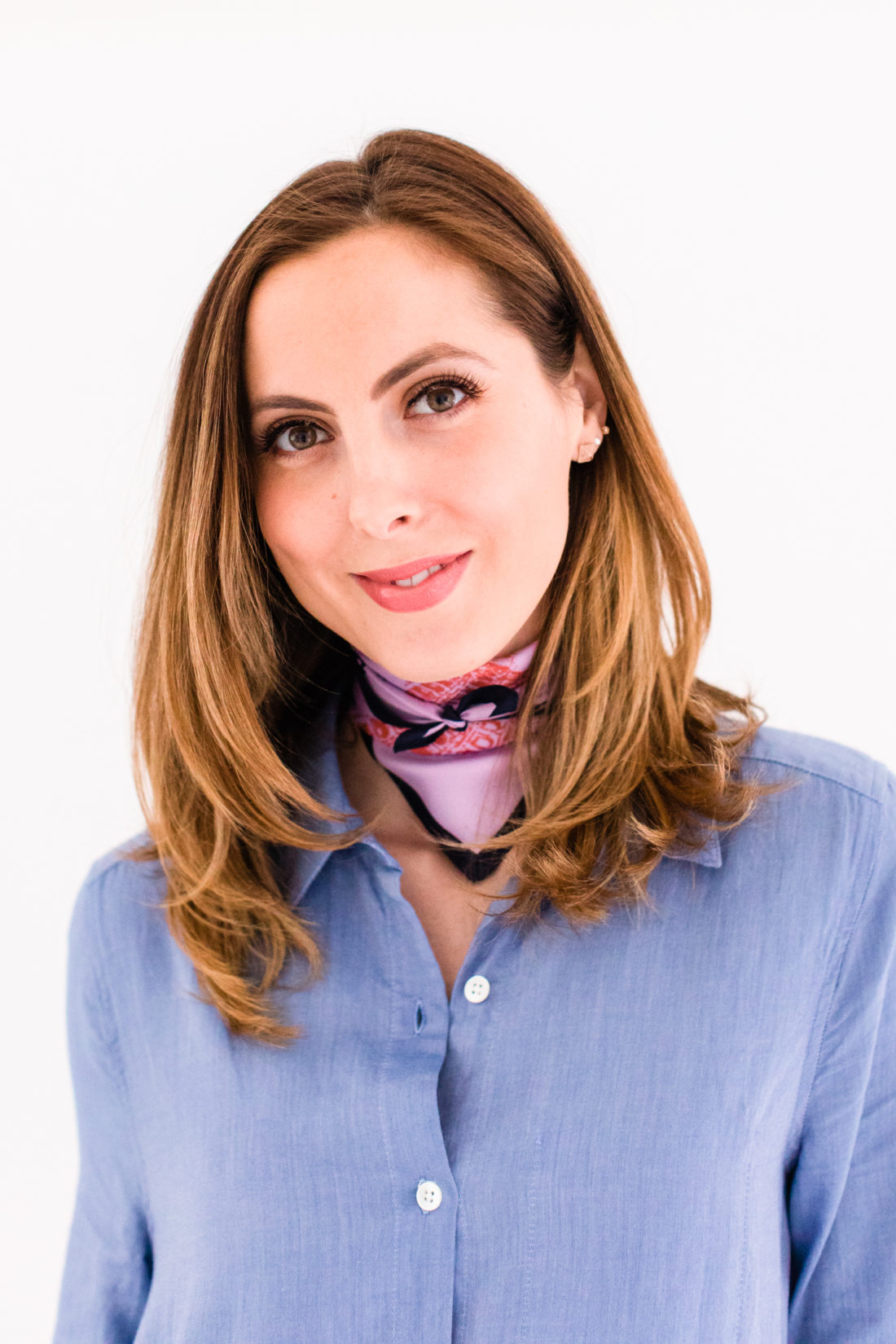 Eva Amurri Martino wears a light blue shirtdress and a silk scarf bandana tied around her neck