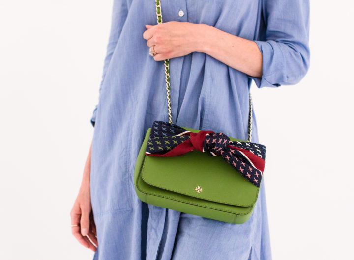 Eva Amurri Martino wears a blue shirt dress and styles a silk scarf to adorn her green tory burch bag
