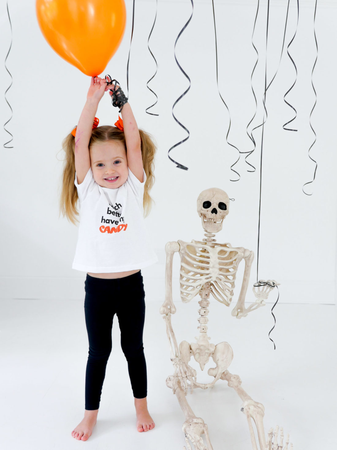 Marlowe Martino wears a festive Halloween tee shirt designed using The Happily App