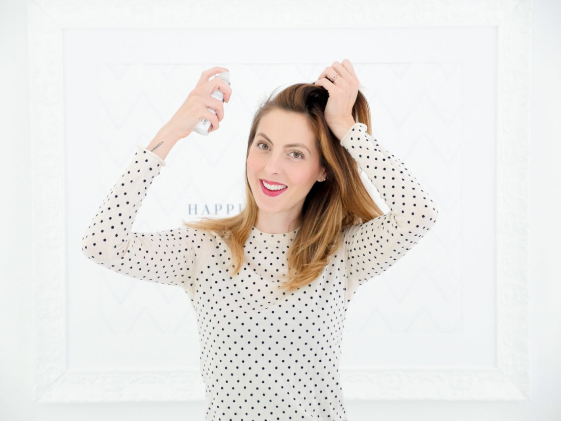 Eva Amurri Martino applies dry shampoo to her blowout as part of her monthly obsessions product roundup