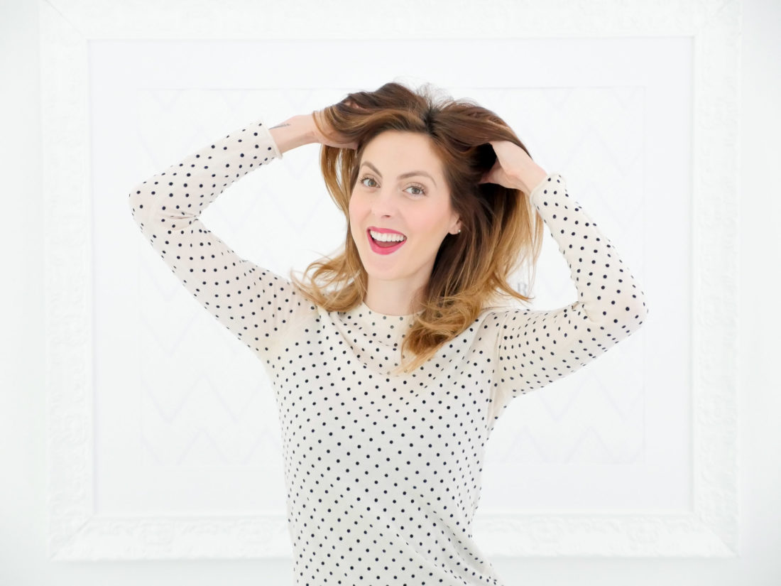 Eva Amurri Martino applies dry shampoo to her blowout as part of her monthly obsessions product roundup
