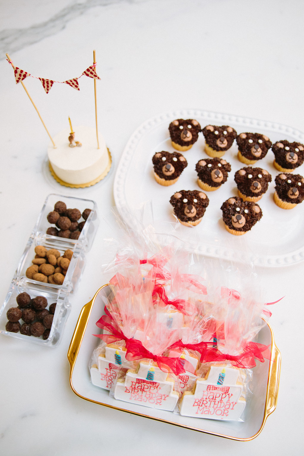 The dessert bar at Major Martino's teddy bear picnic themed first birthday party