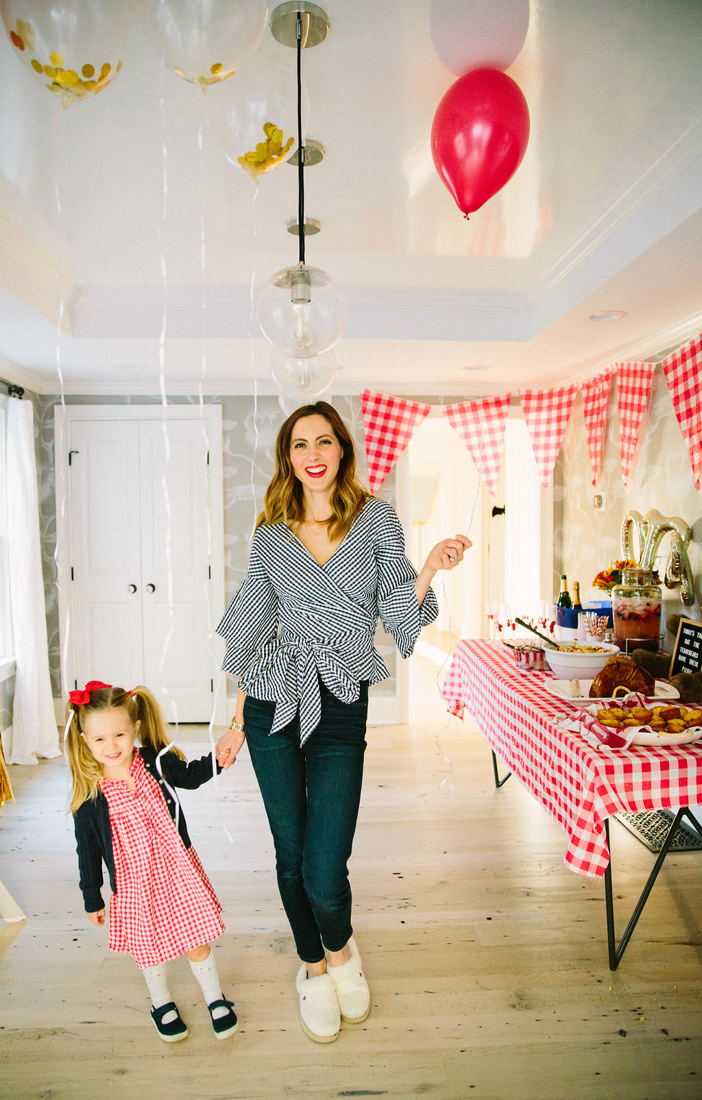 Eva Amurri Martino stands with three year old daughter Marlowe in the room decorated to celebrate Major Martino's first birthday with a teddy bear picnic theme