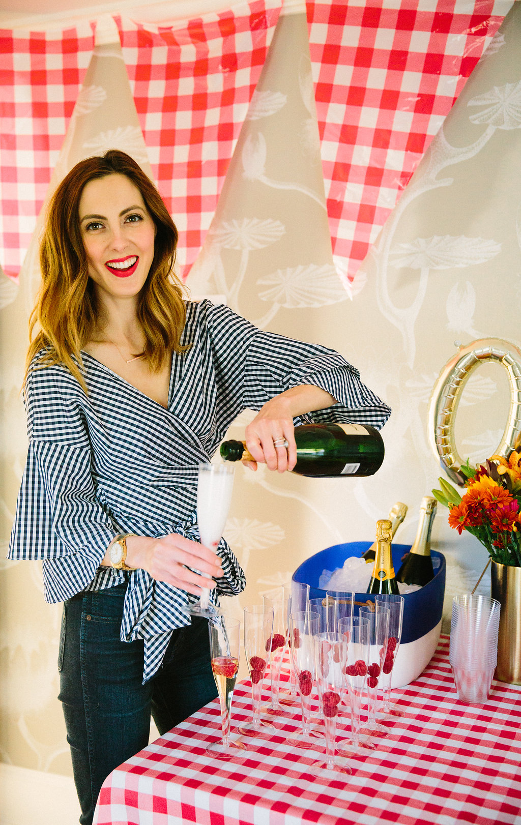 Eva Amurri Martino pours a glass of champagne at her son's first birthday party