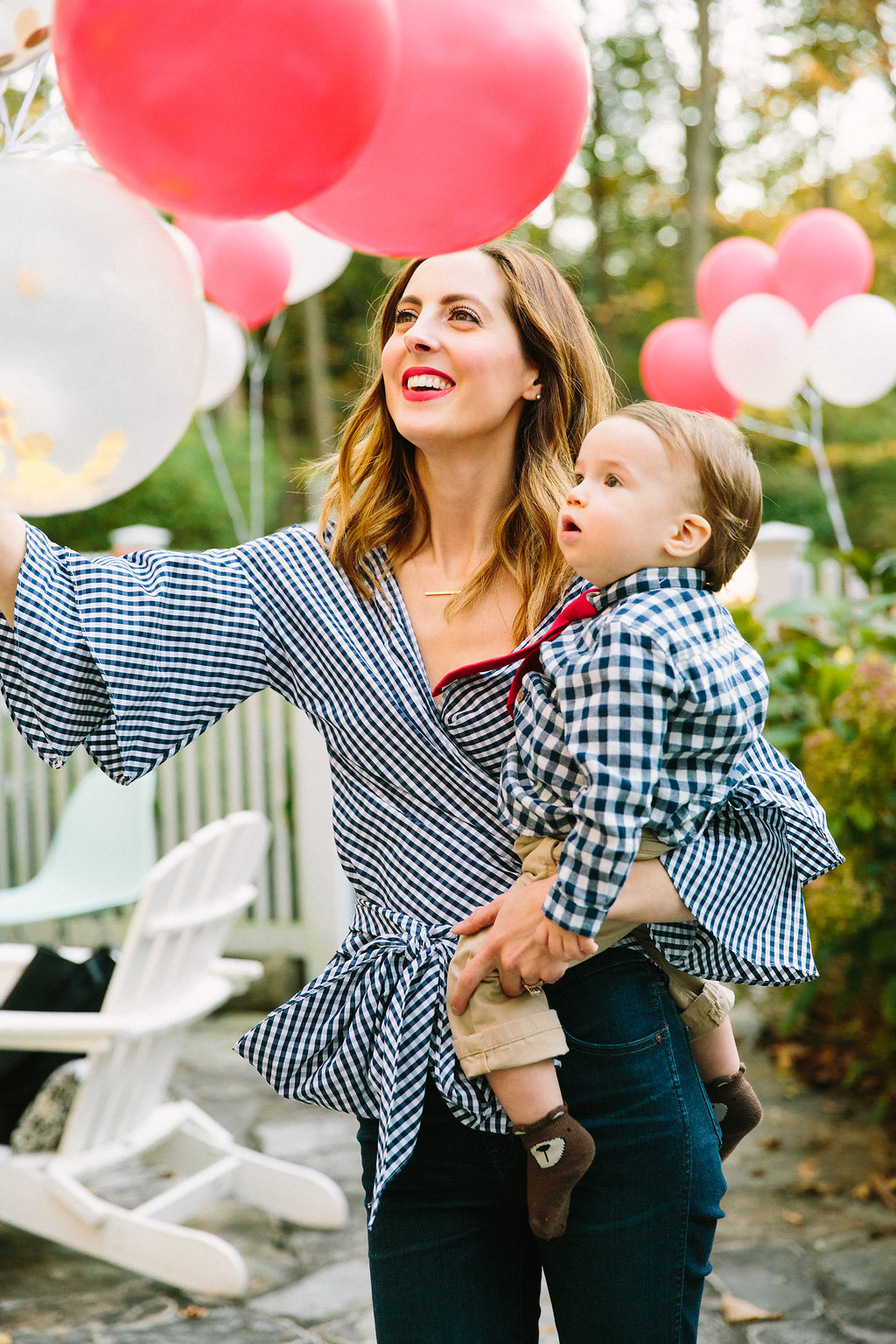Eva Amurri Martino holds one year old son Major as they celebrate his first birthday with a teddy bear picnic themed party