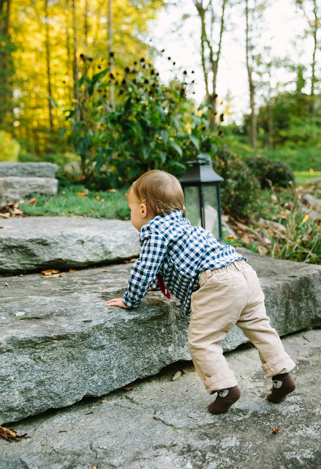 Major Martino climbs up the stone steps in his backyard in Connecticut