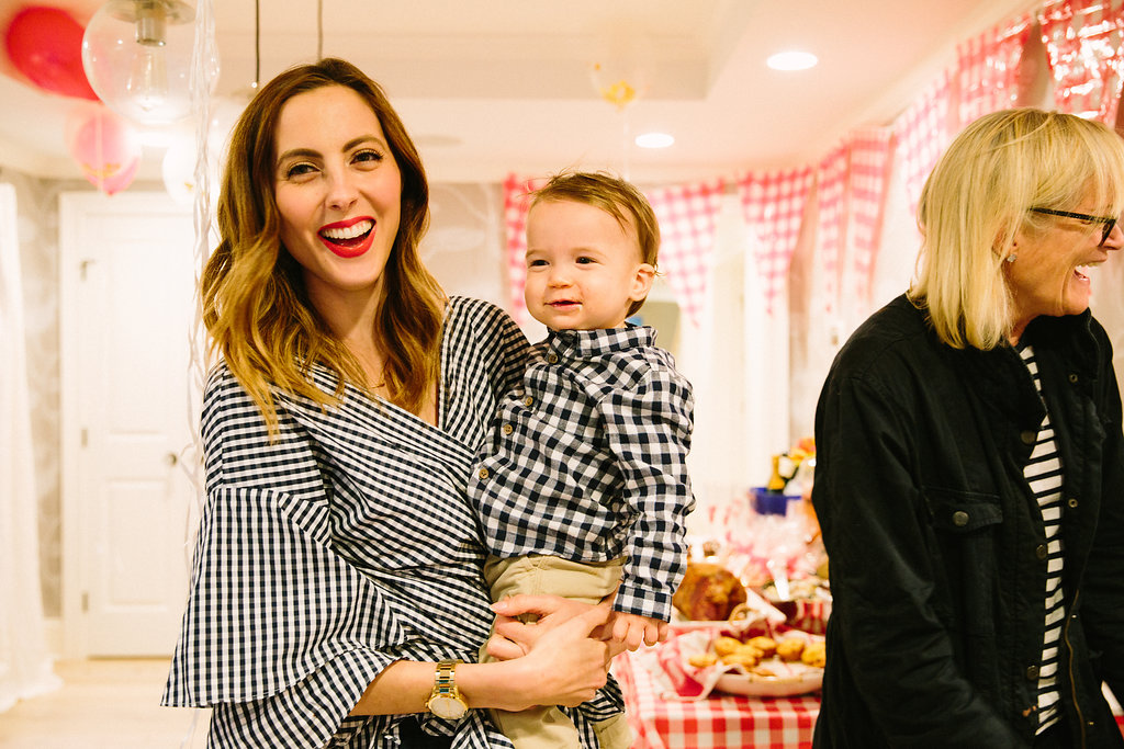 Eva Amurri Martino laughs holding son Major at his first birthday party