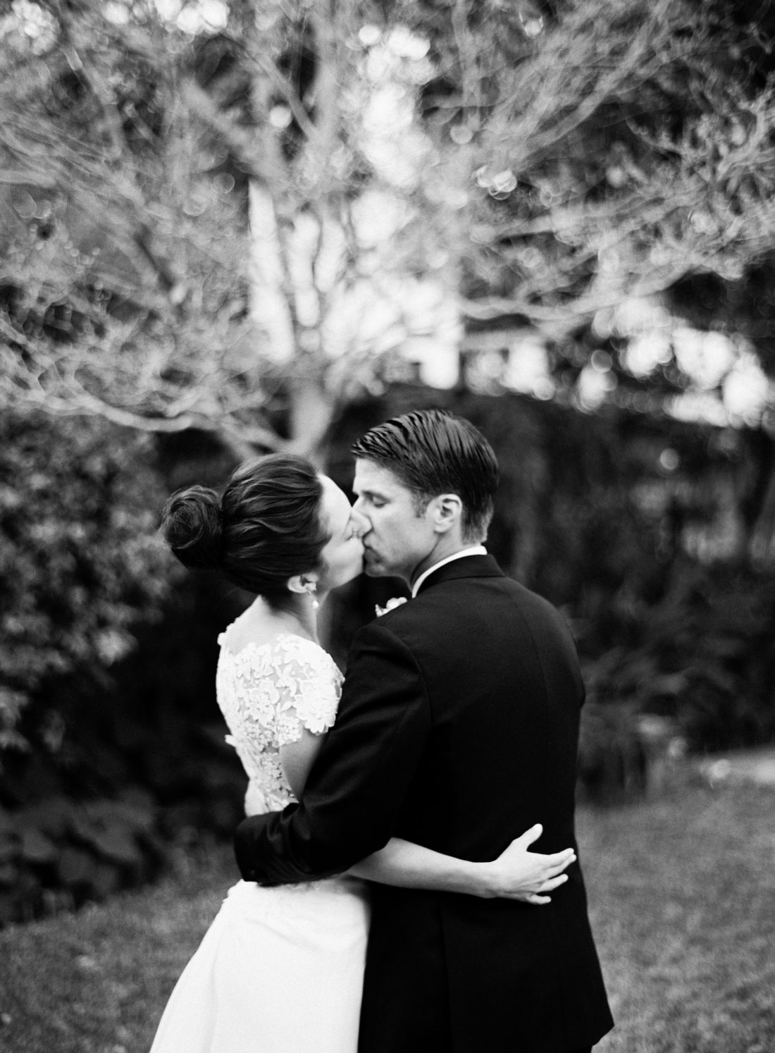 Eva Amurri Martino and Kyle Martino share a kiss in the courtyard on their weddding day in Charleston South Carolina