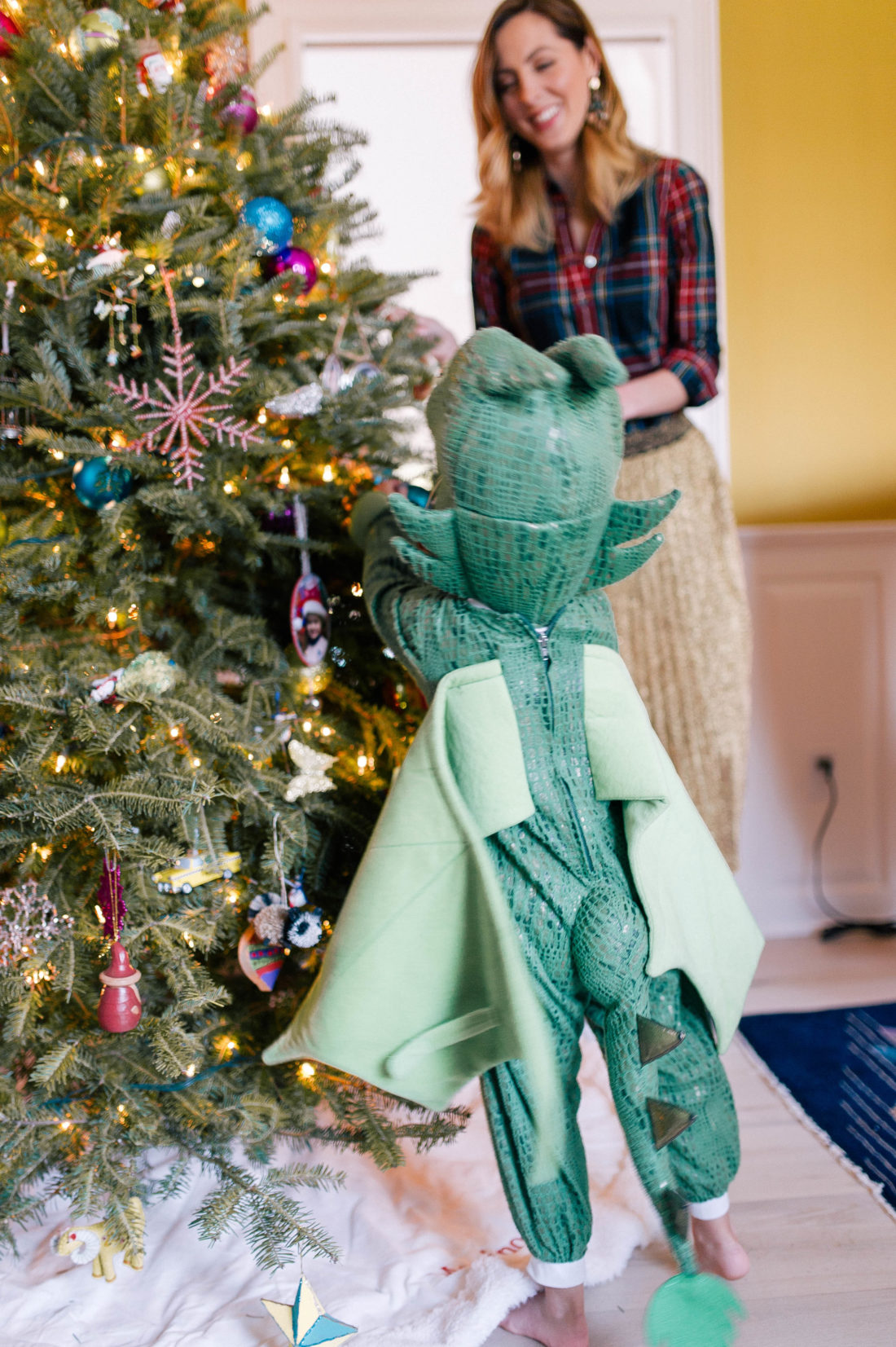 Marlowe Martino dresses up in a dragon costume and decorates the christmas tree