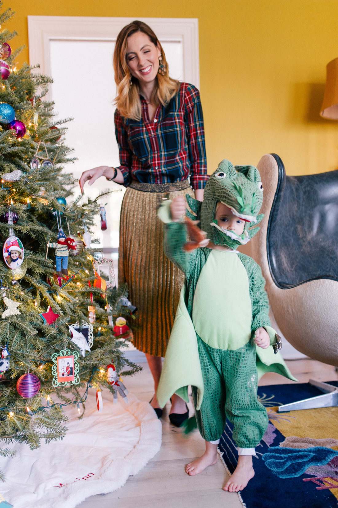 Marlowe Martino dresses up in a dragon costume and decorates the christmas tree