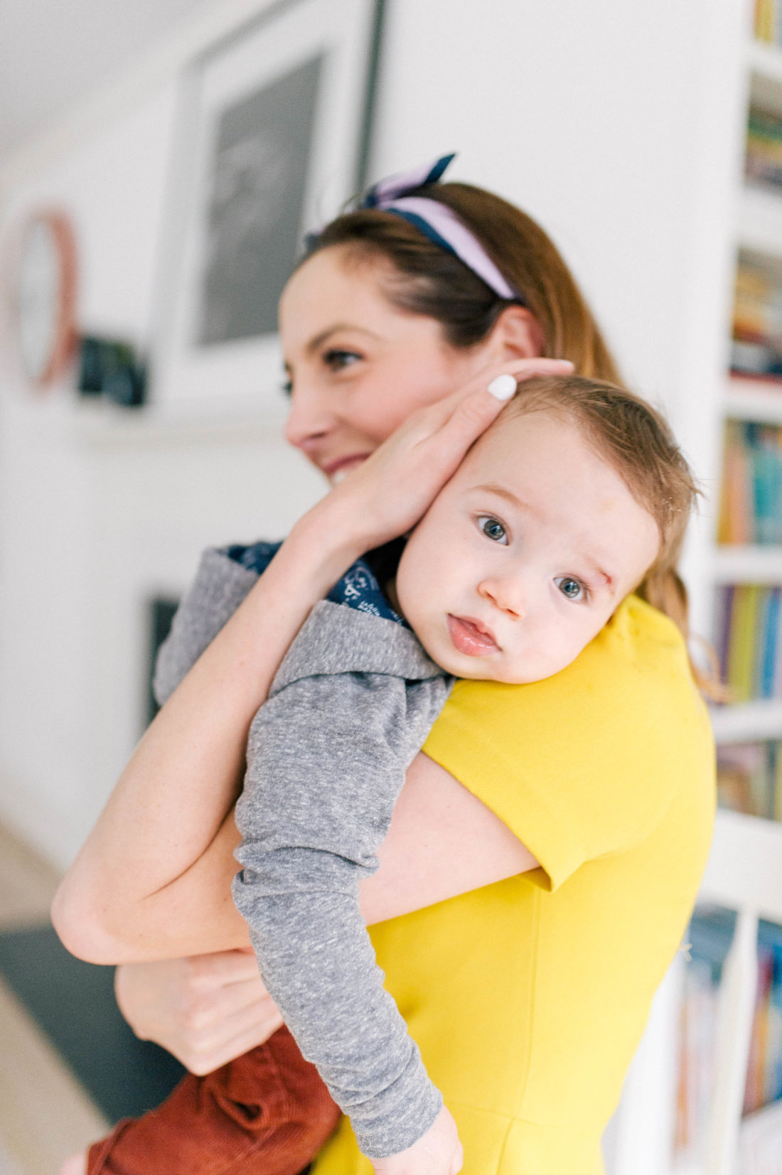 Major Martino snuggles her son Major in the kitchen of her Connecticut home