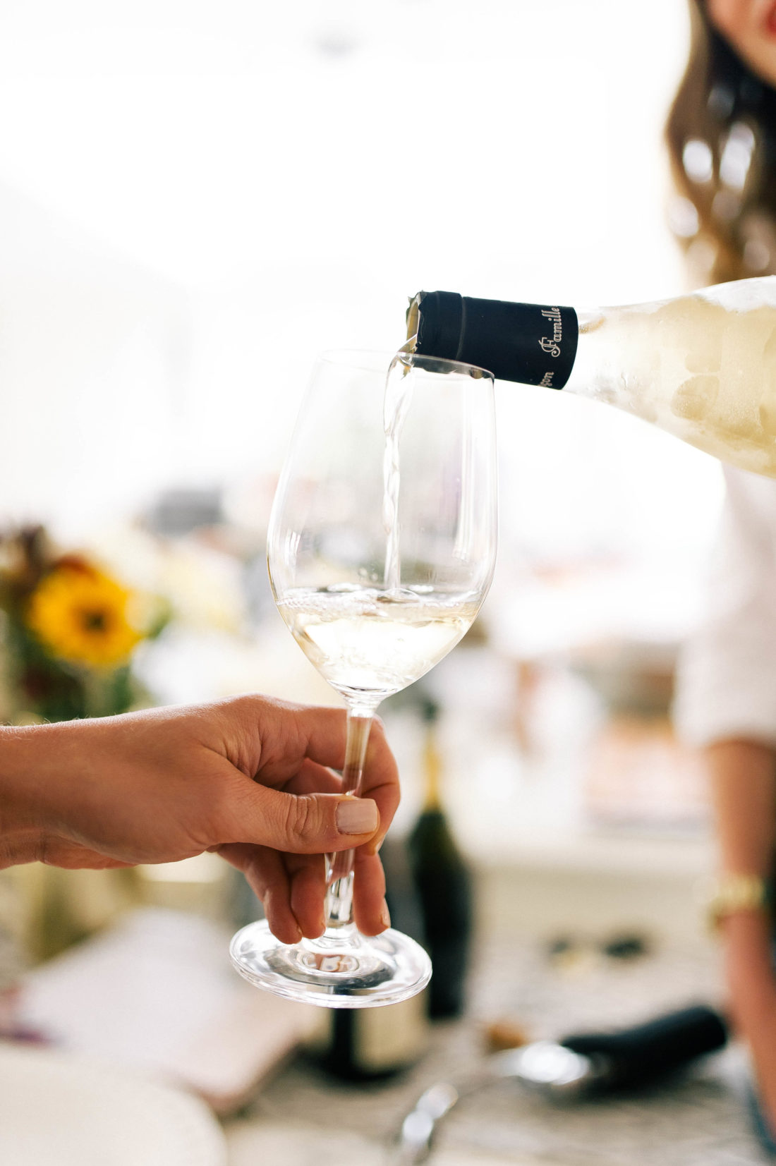 A glass of white wine is poured at Eva Amurri Martino's Connecticut home