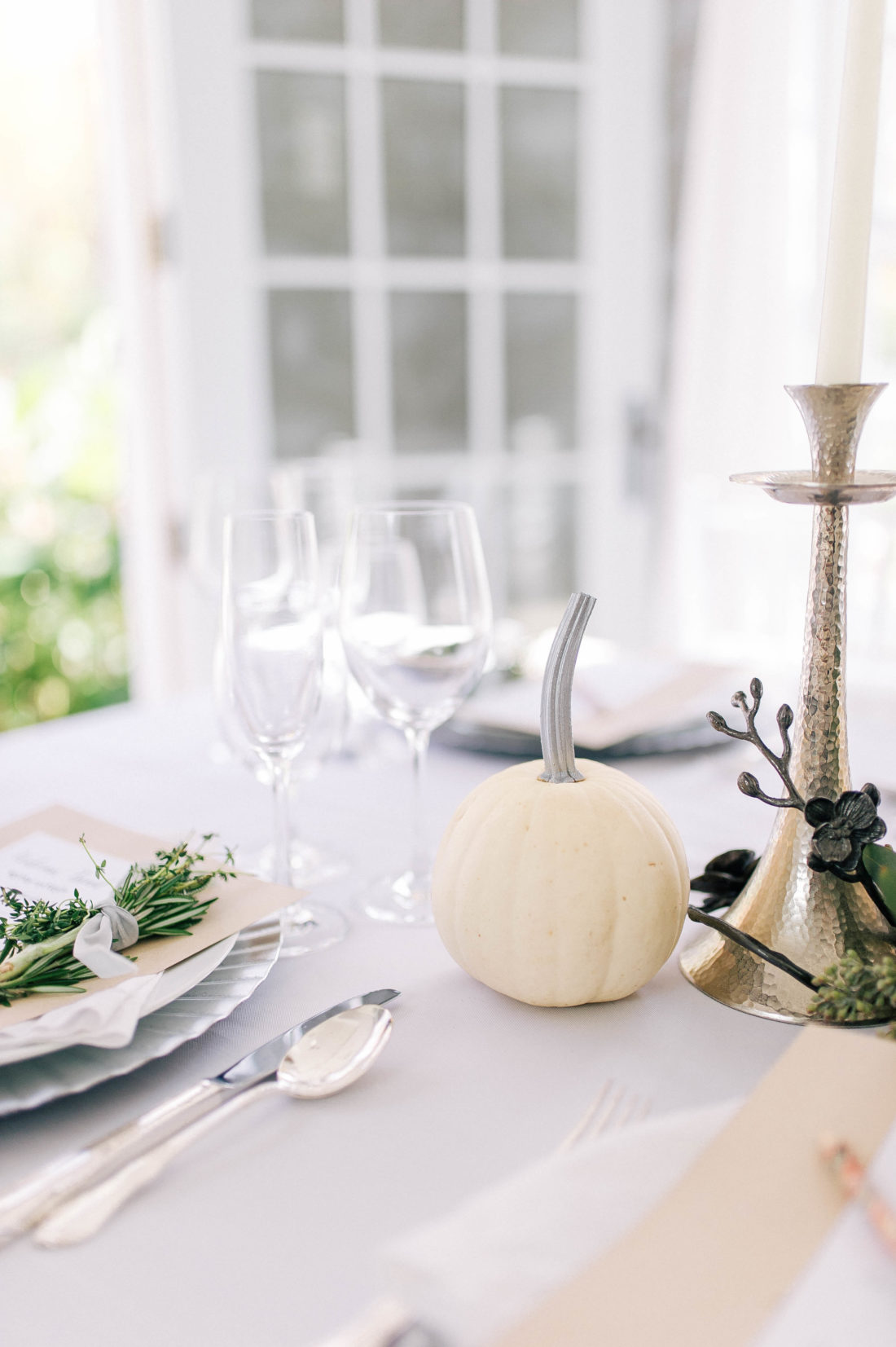 A white pumpkin with a painted silver stem on the Friendsgiving table at Eva Amurri Martino's Connecticut home