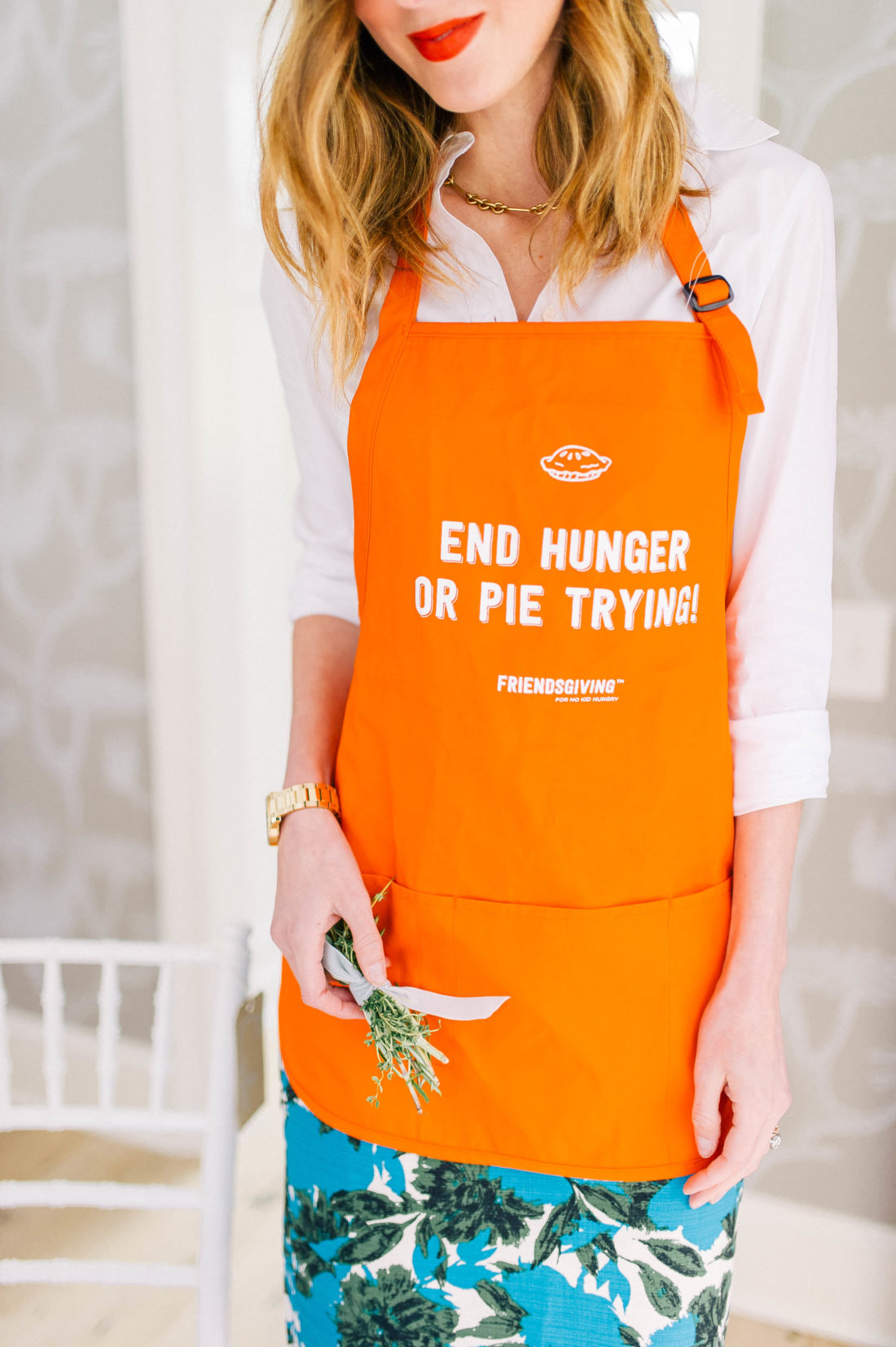 Eva Amurri Martino wears an "end hunger or pie trying" No Kid Hungry apron for Friendsgiving at her Connecticut home