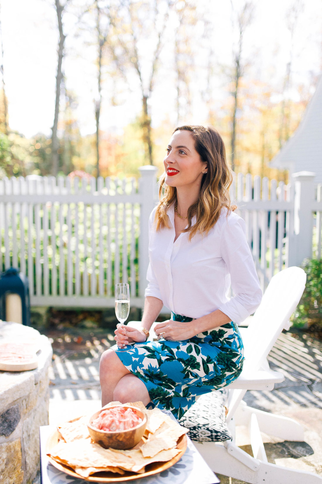 Eva Amurri Martino sits with a cocktail outside on the patio of her Connecticut home