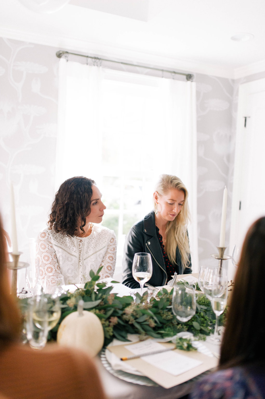 Guests listen as Eva Amurri Martino speaks about her involvement with No Kid Hungry for Friendsgiving