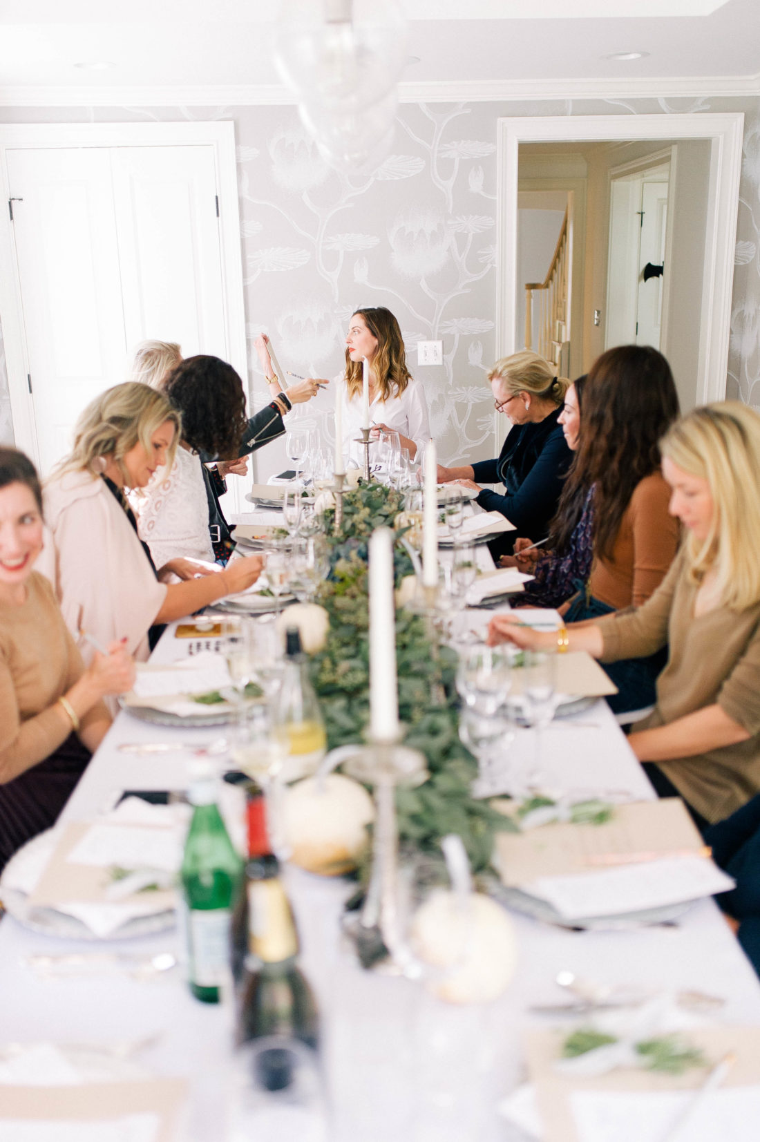 Guests listen as Eva Amurri Martino speaks about her involvement with No Kid Hungry for Friendsgiving