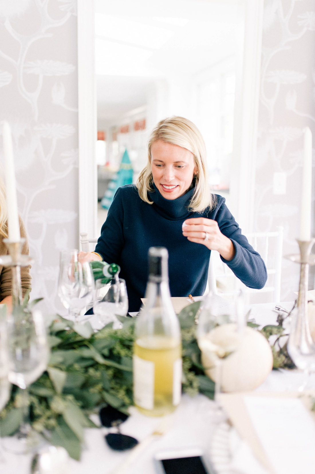 guests eat and chat at Eva Amurri Martino's Friendsgiving at her Connecticut home