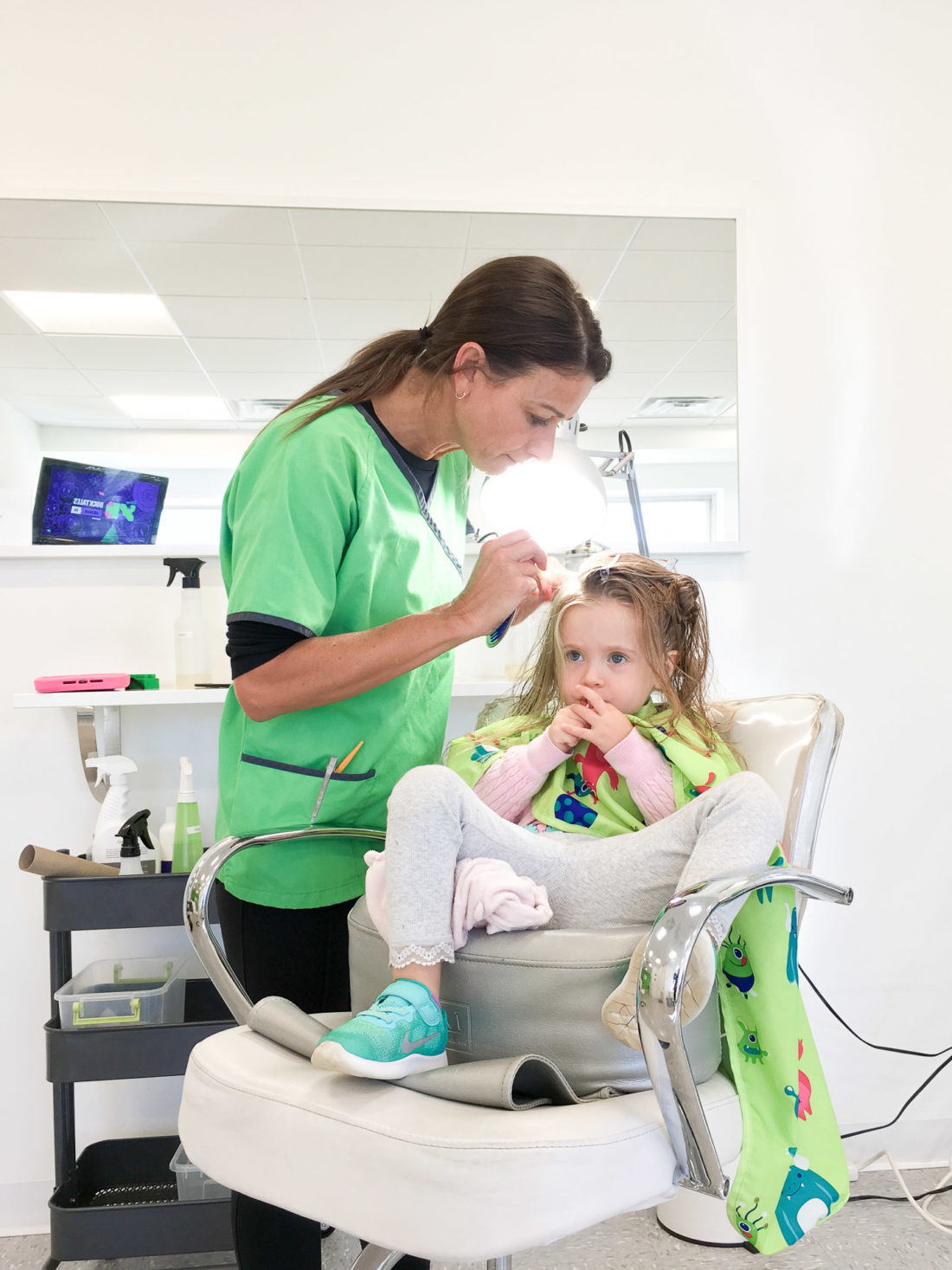 Marlowe Martino gets her head combed over for lice