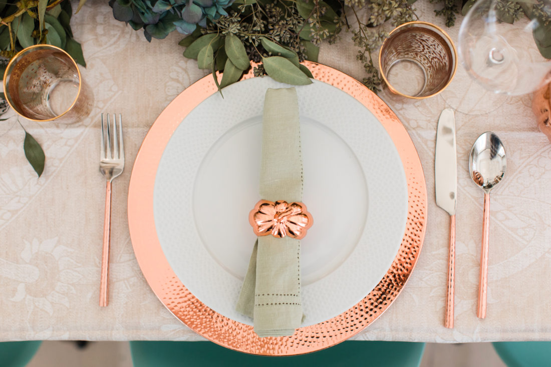 Copper pumpkin napkin rings on the place settings for Eva Amurri Martino's thanksgiving table