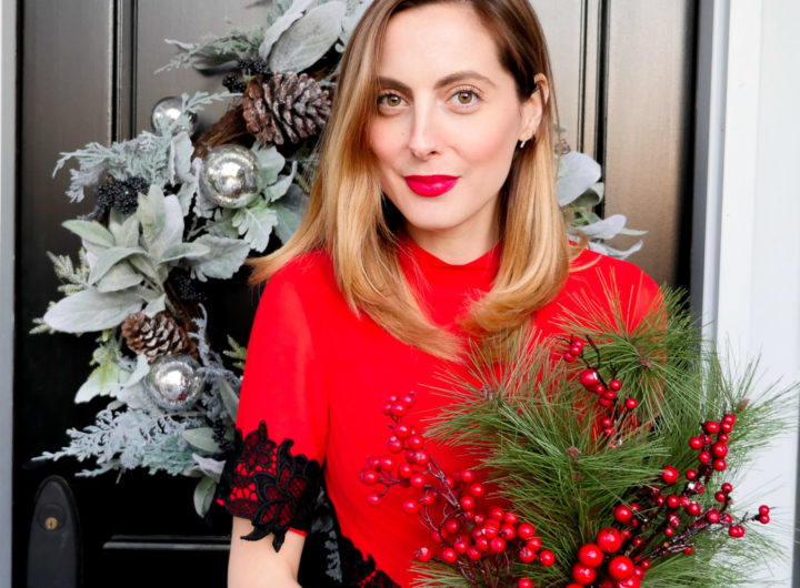 Eva Amurri Martino wears a festive red dress with black lace detailing for a holiday party