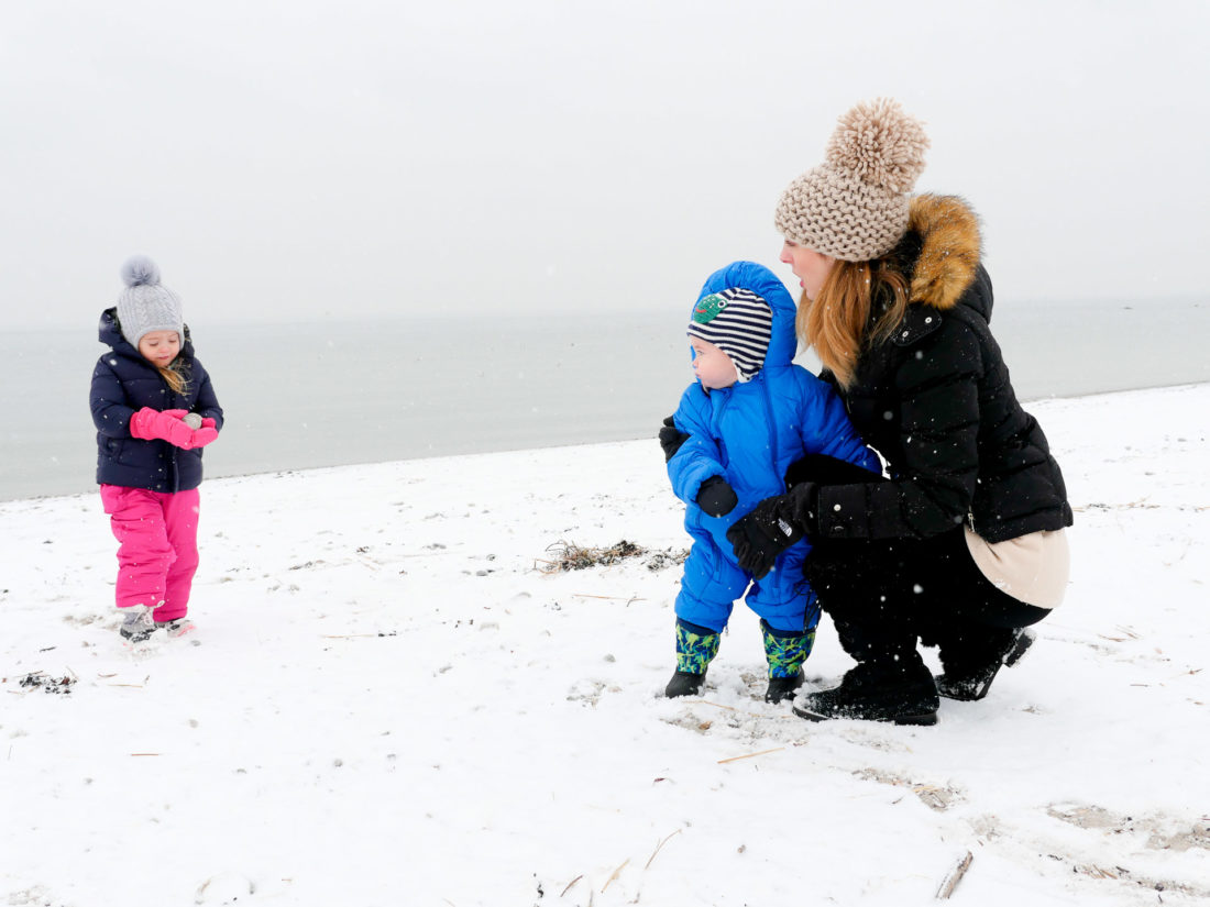 Eva Amurri Martino is playing bundled up on the snowy beach with her two children, Marlowe and Major, in Westport CT