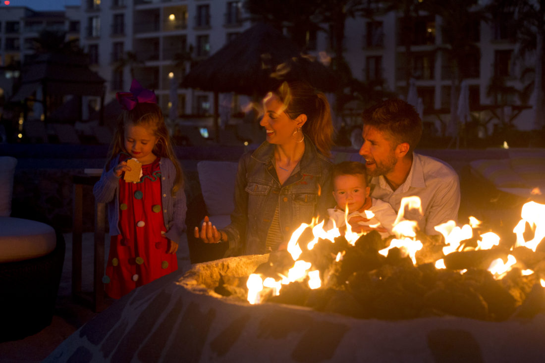 Eva Amurri Martino, Kyle Martino, Marlowe Martino, and Major Martino make s'mores on the beach in los cabos Mexico