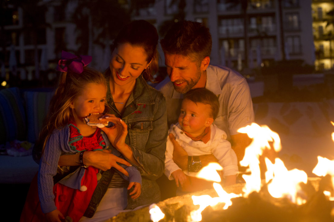 Eva Amurri Martino, Kyle Martino, Marlowe Martino, and Major Martino make s'mores on the beach in los cabos Mexico