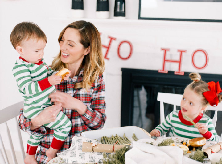 Eva Amurri Martino sits with children marlowe and major around the kitchen table decorated for Christmas brunch