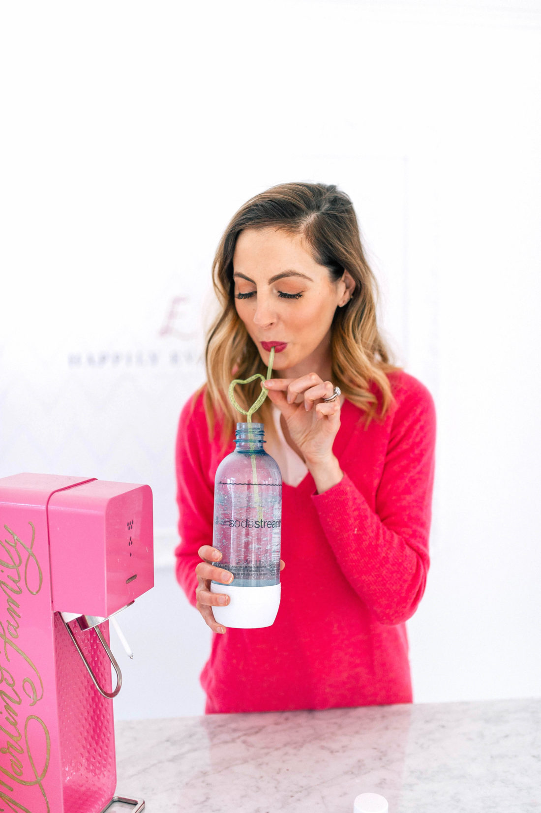 Eva Amurri Martino takes a sip of her sparkling water