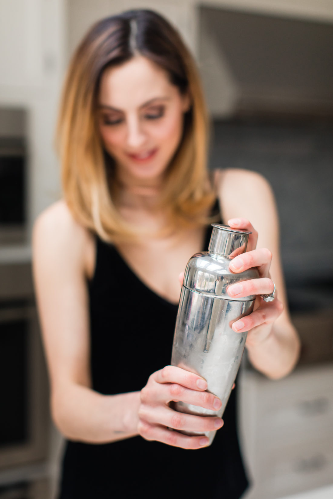 Eva Amurri Martino shakes up a whiskey sour in a cocktail shaker