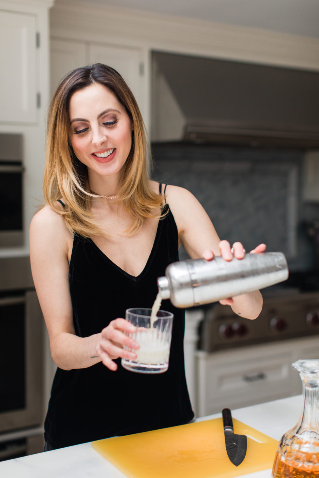 Eva Amurri Martino pours a whiskey sour in the kitchen of her Connecticut home
