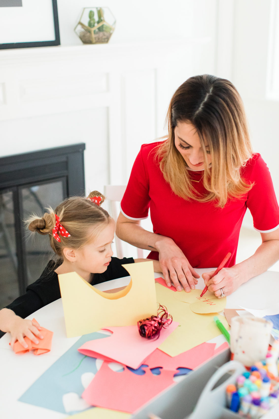 Eva Amurri Martino decorates a cutout paper heart for Valentine's Day cards