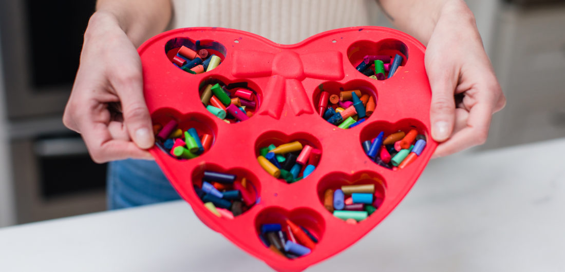 Eva Amurri Martino prepares to make crayon hearts out of bits of broken crayons in a heart mold