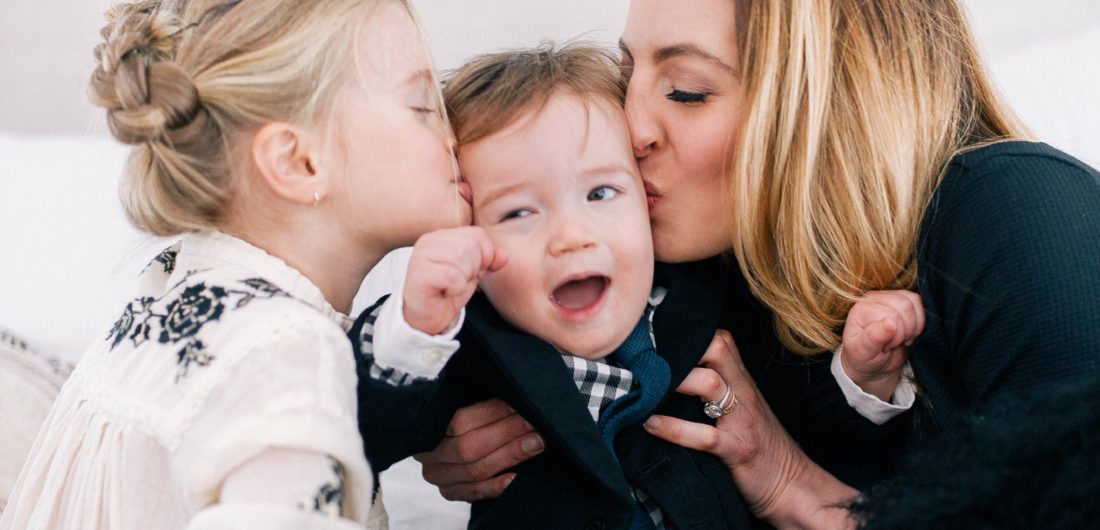 Eva Amurri Martino and her daughter Marlowe Mae Martino kissing son Major James Martino on the bed in their Connecticut home.