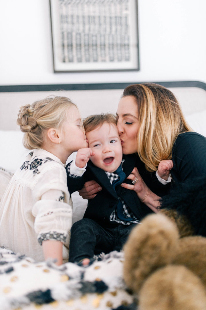 Eva Amurri Martino and her daughter Marlowe Mae Martino kissing son Major James Martino on the bed in their Connecticut home.