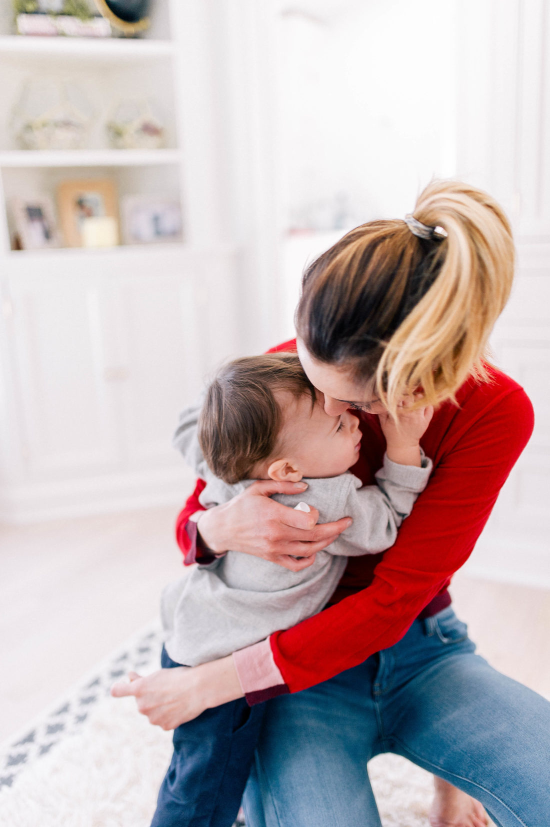 Eva Amurri Martino snuggles one year old son Major before getting him ready for bath time