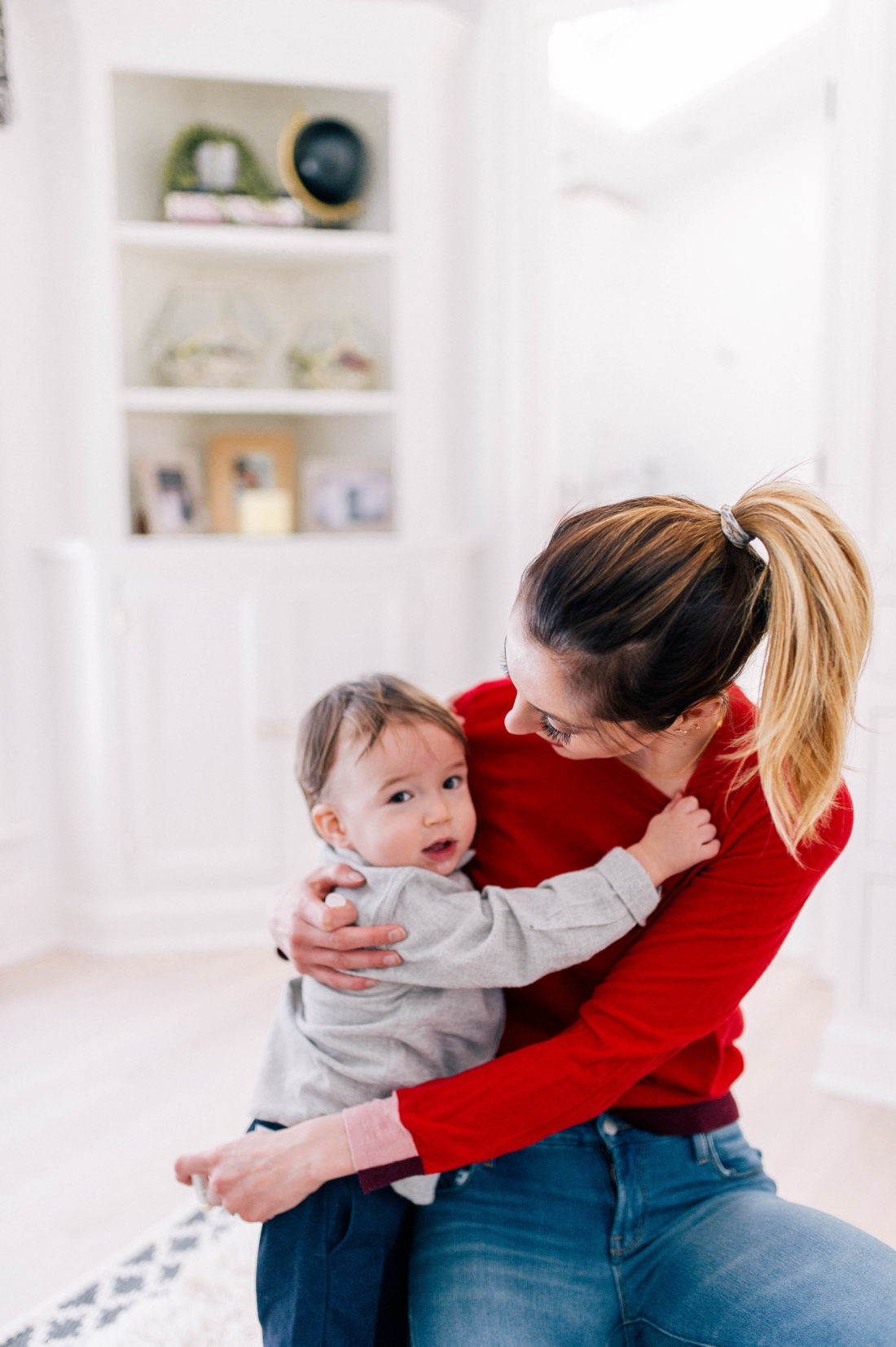 Eva Amurri Martino holds one year old son Major before getting him ready for bath time