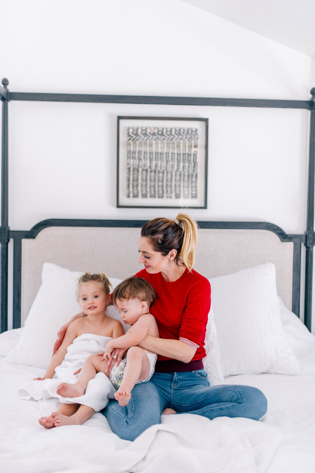 Eva Amurri Martino sits on the master bed in her Connecticut home with her two children as she readies them for bed