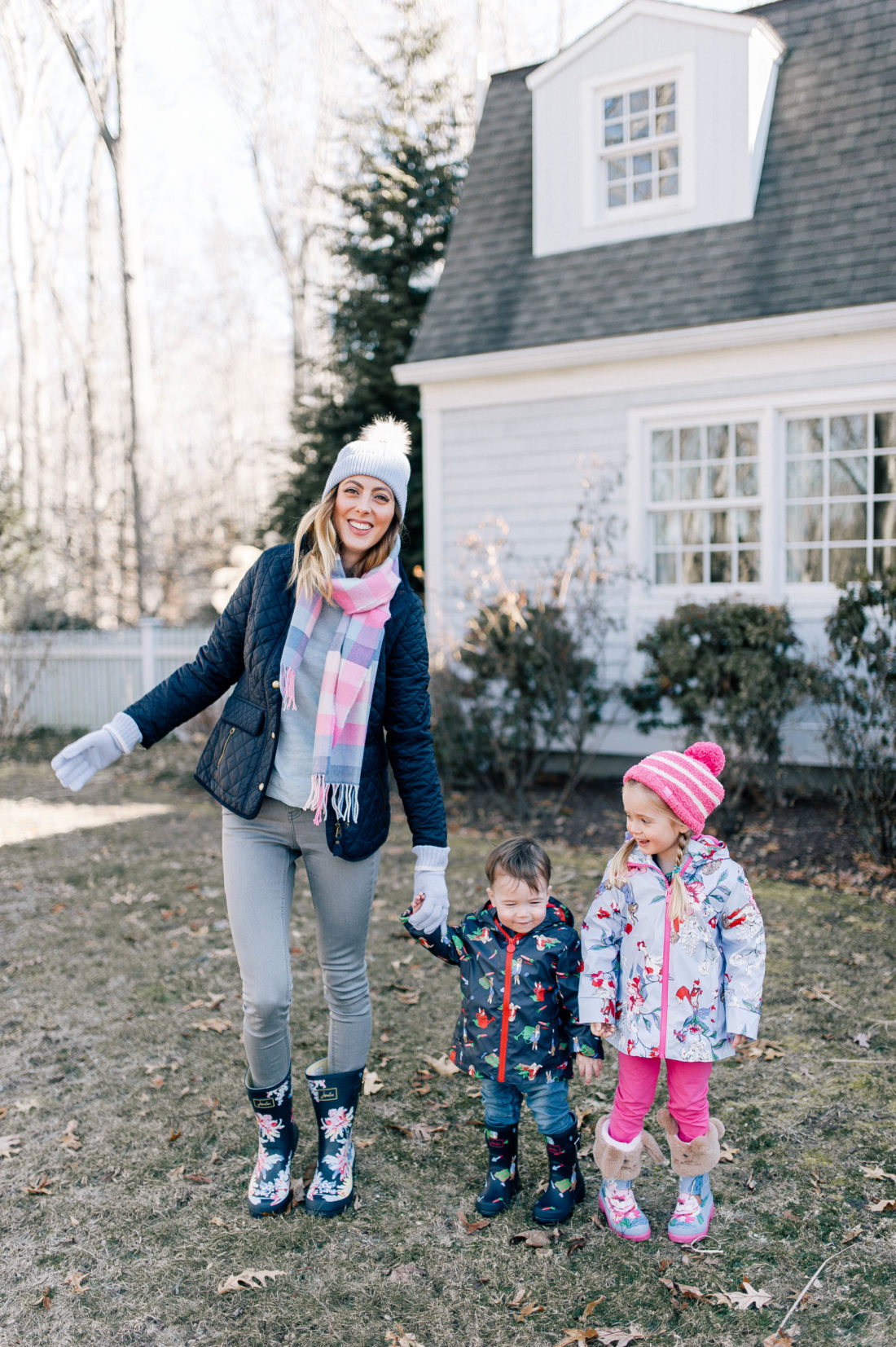 Eva Amurri Martino is bundled up in Peter Rabbit themed clothes with her two children playing outside of their connecticut home