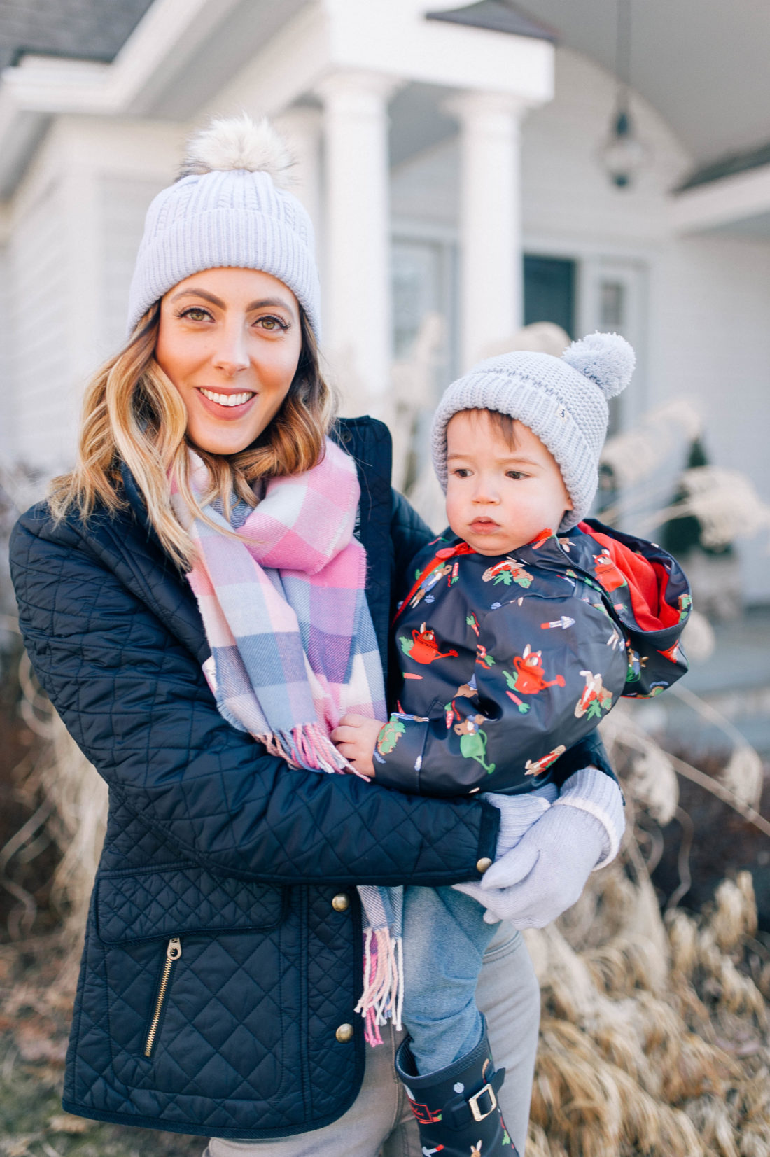 Eva Amurri Martino holds one year old son Major and walks through the garden of her Connecticut home