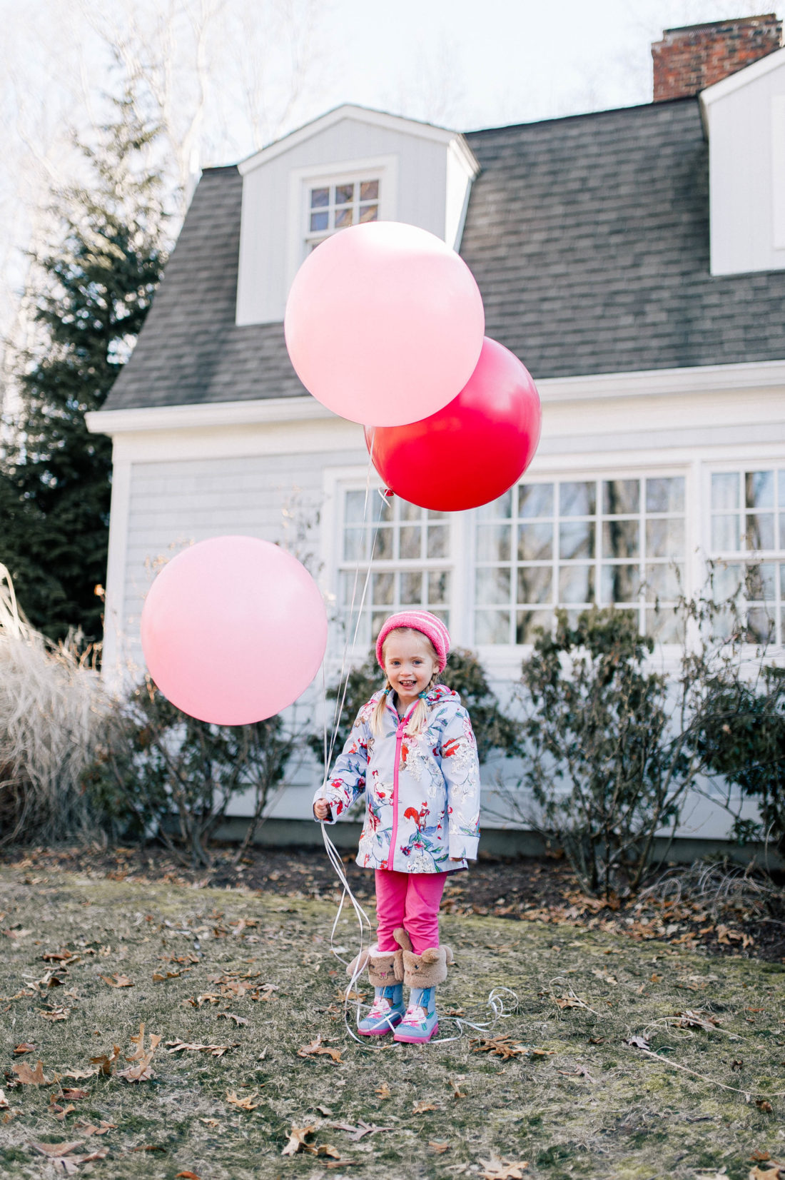 Marlowe Martino frolics through the garden of her Connecticut home holding balloons and wearing a Peter Rabbit themed outfit