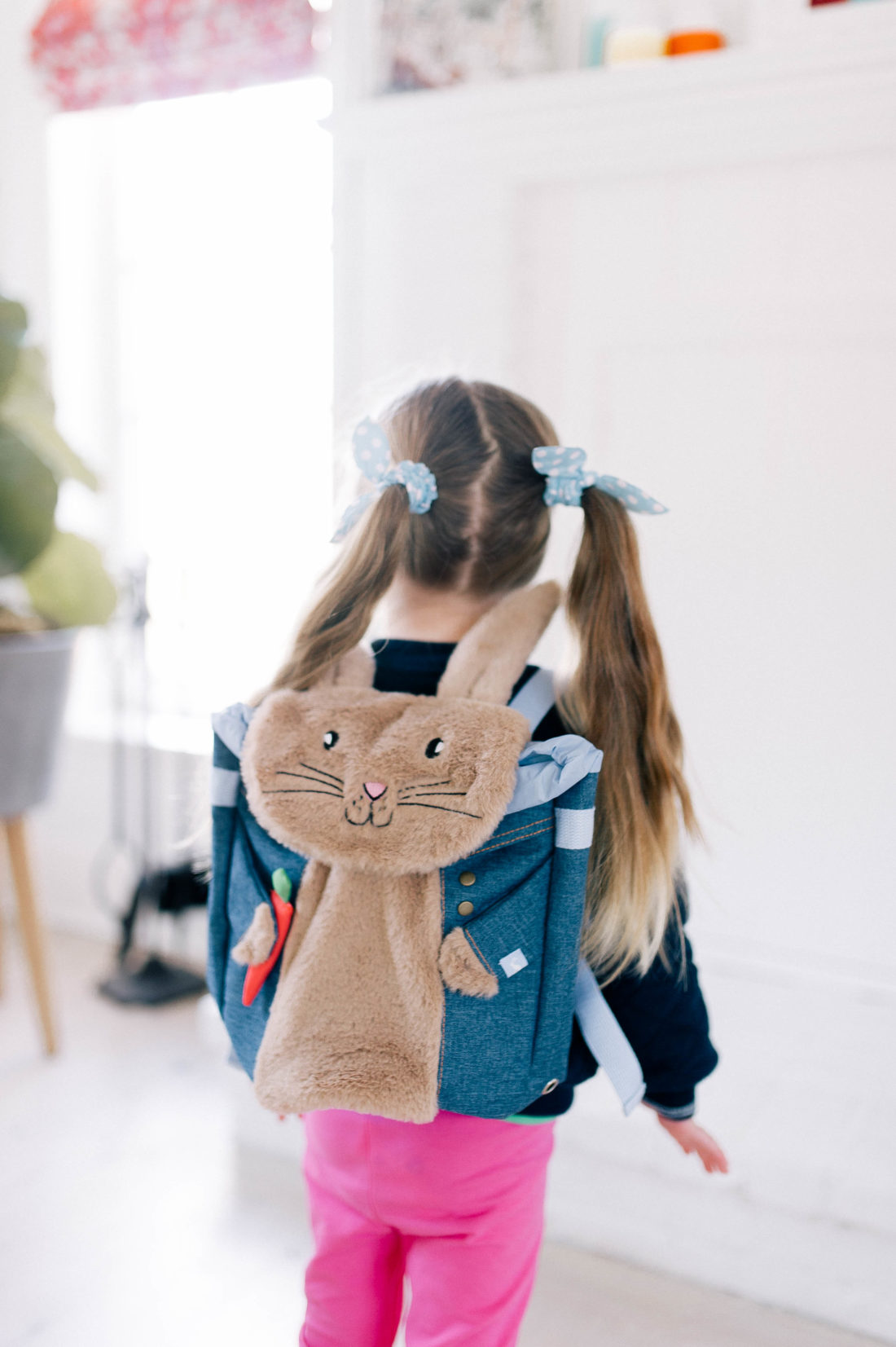 Marlowe Martino wears a fuzzy Peter Rabbit backpack