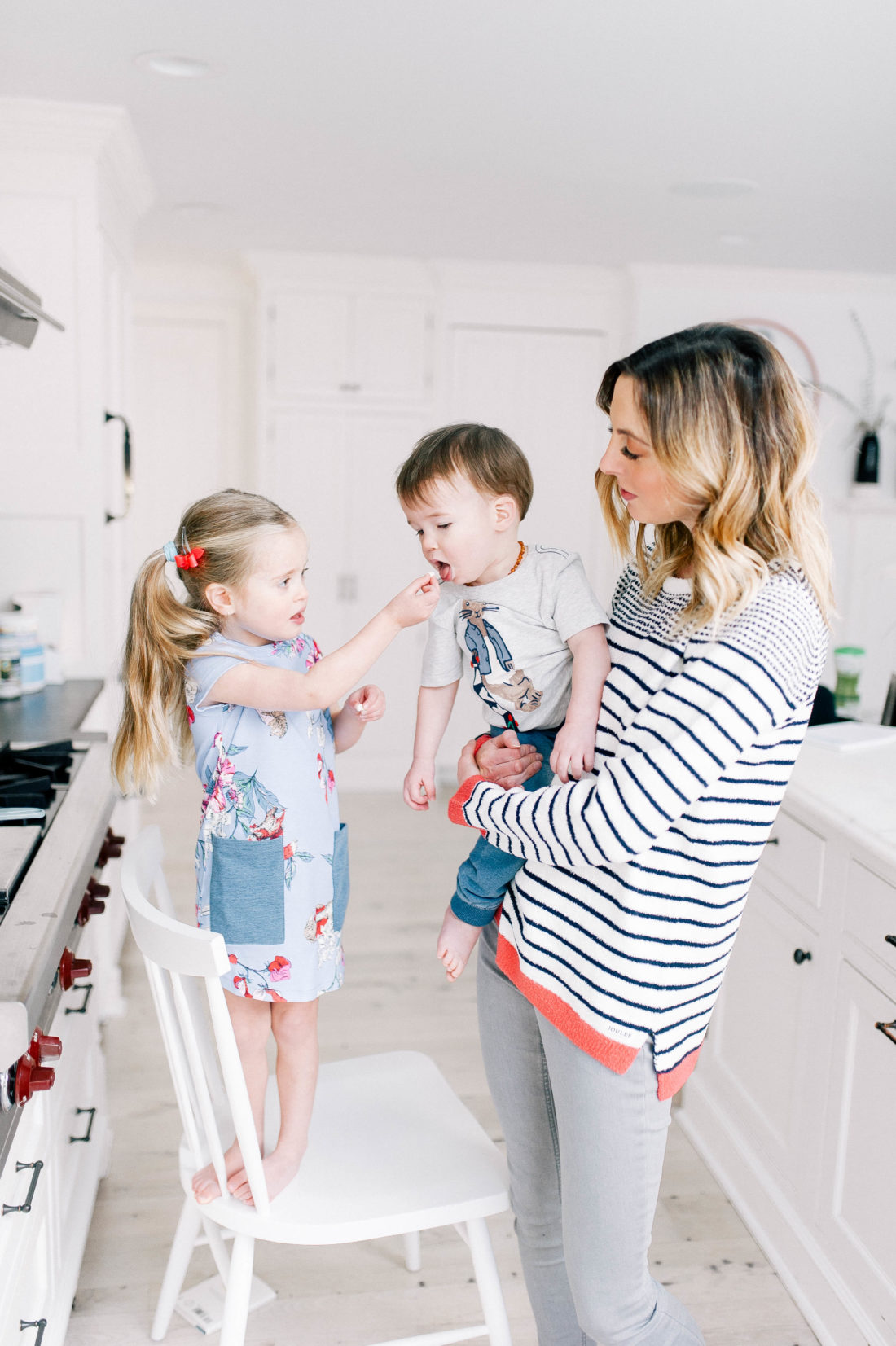 Marlowe Martino feeds little brother Major a chocolate chip at home in Connecticut