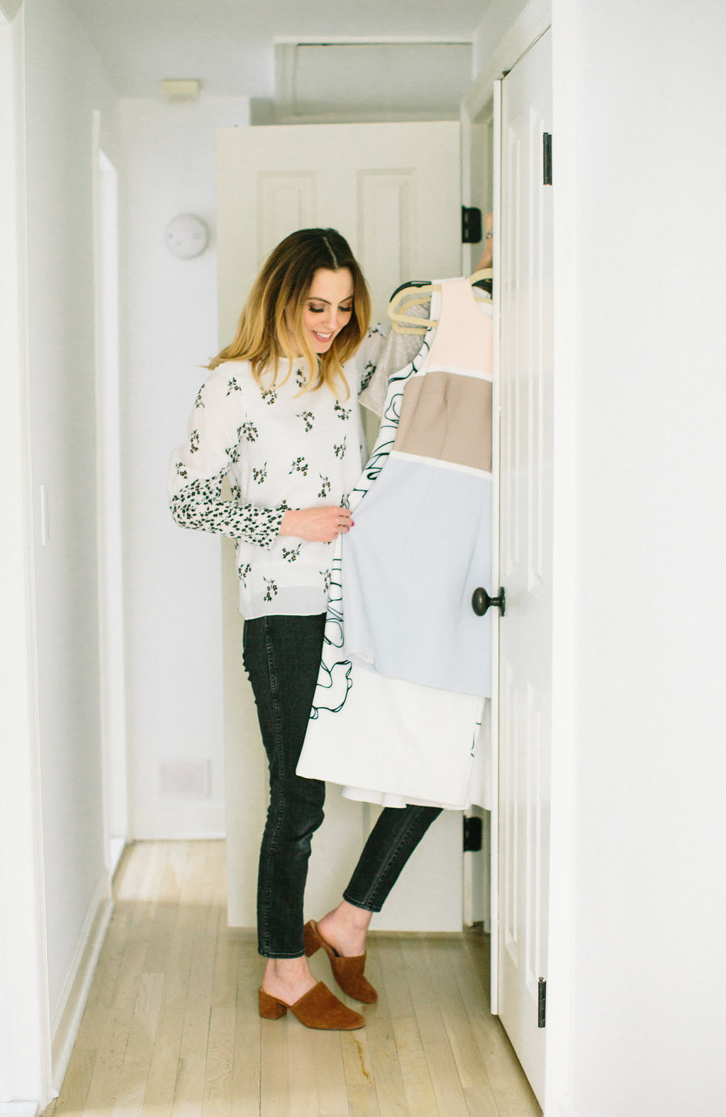 Eva Amurri Martino organizes her closet and puts pieces away according to color, type, and style