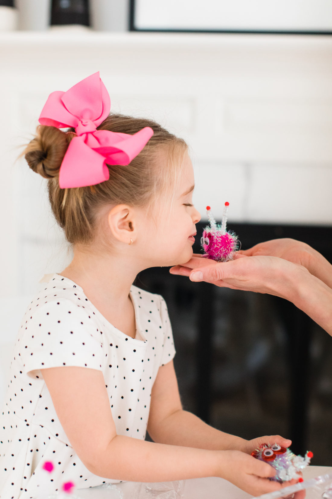 Marlowe Martino kisses a little pom pom Lovebug